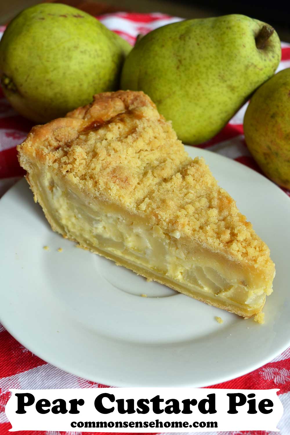 slice of pear custard pie on a white plate with pears in background