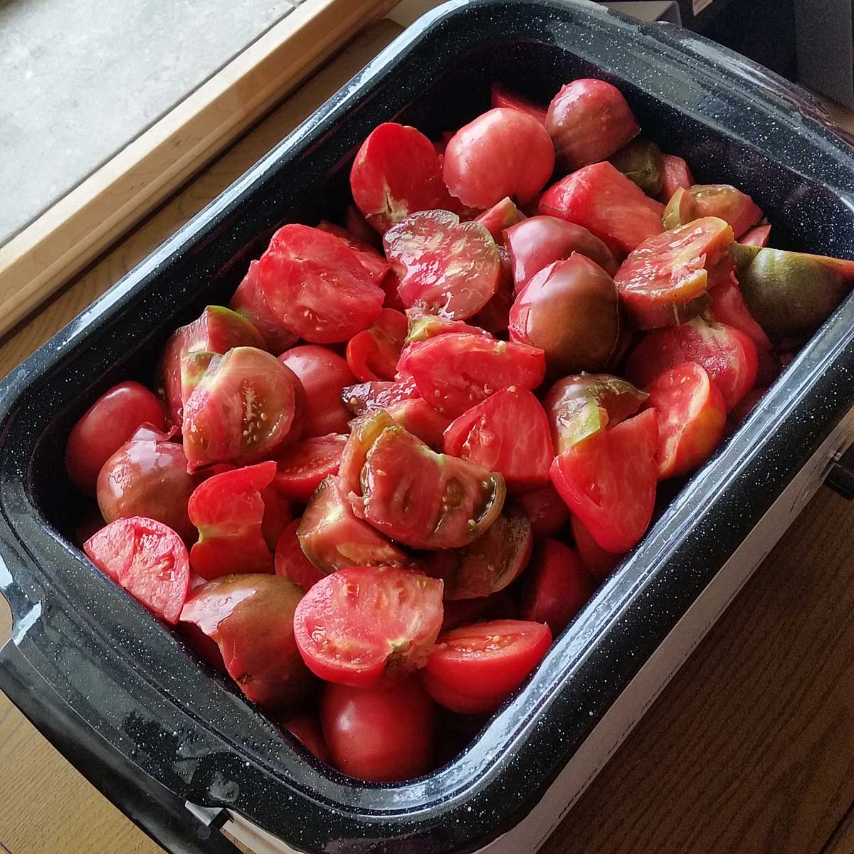 Nesco roaster filled with tomatoes