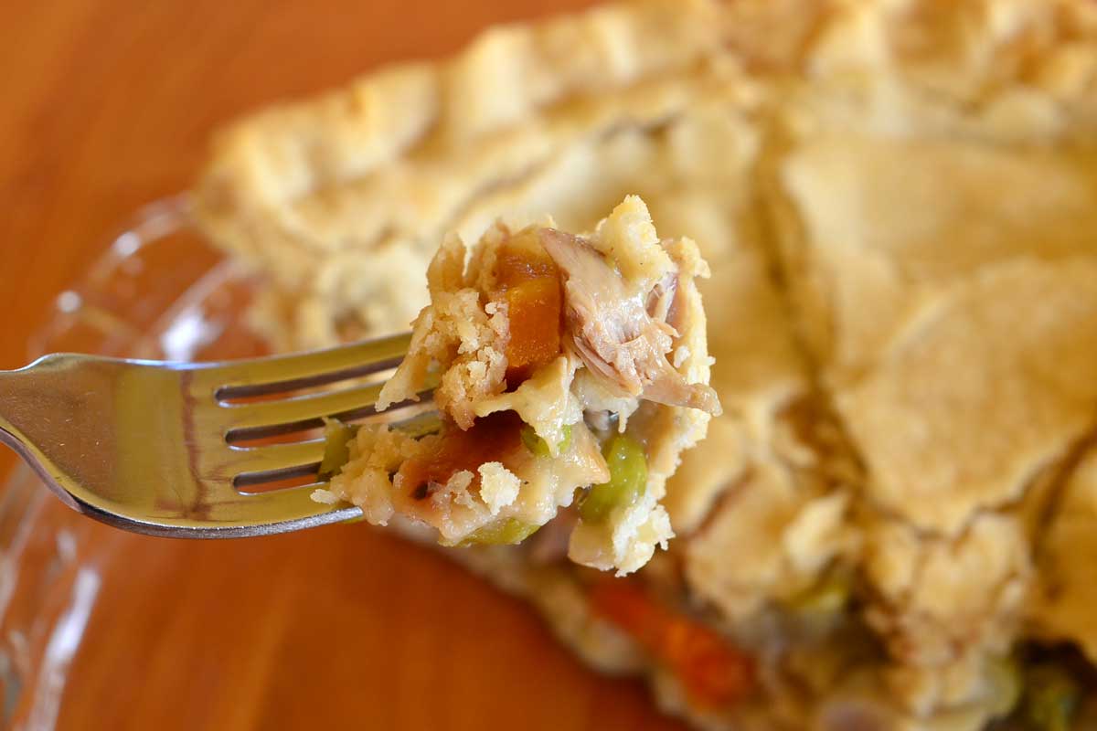 bite of chicken pot pie on fork