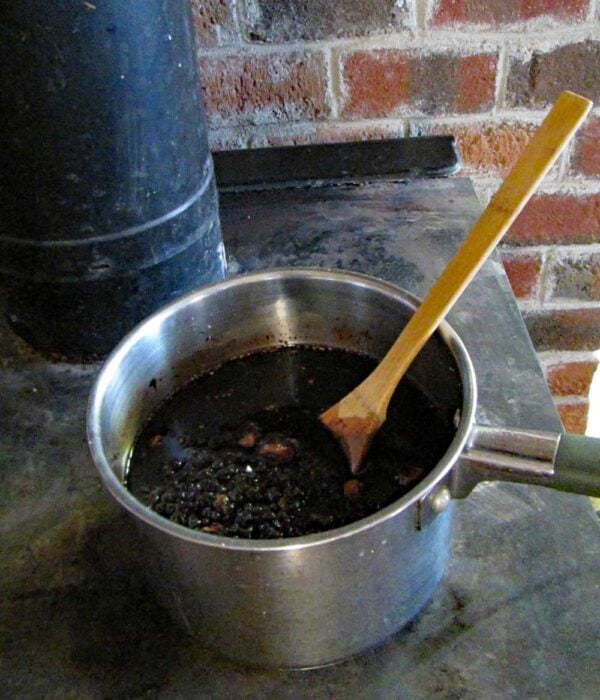 pot cooking on top of wood stove