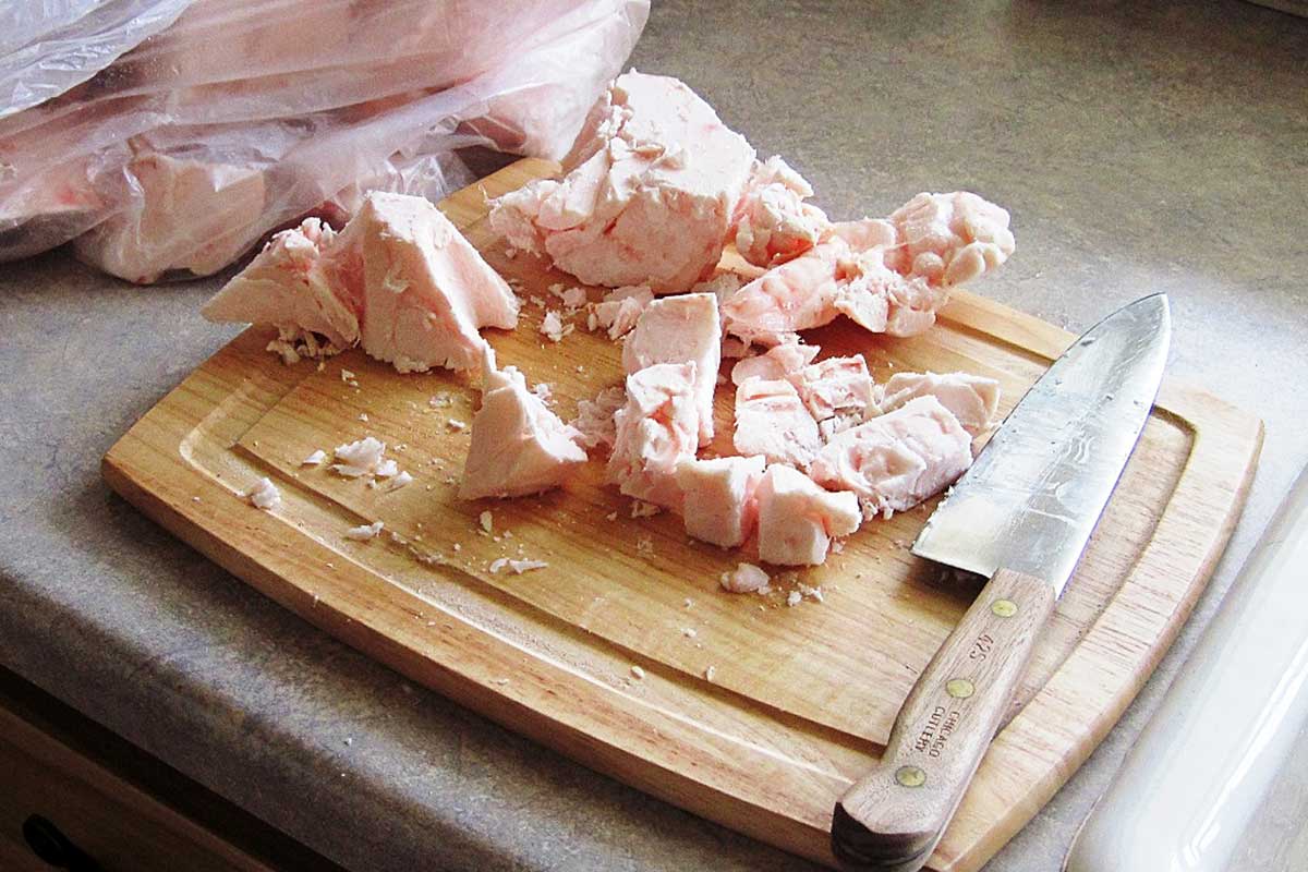 cutting beef fat into small pieces for making tallow