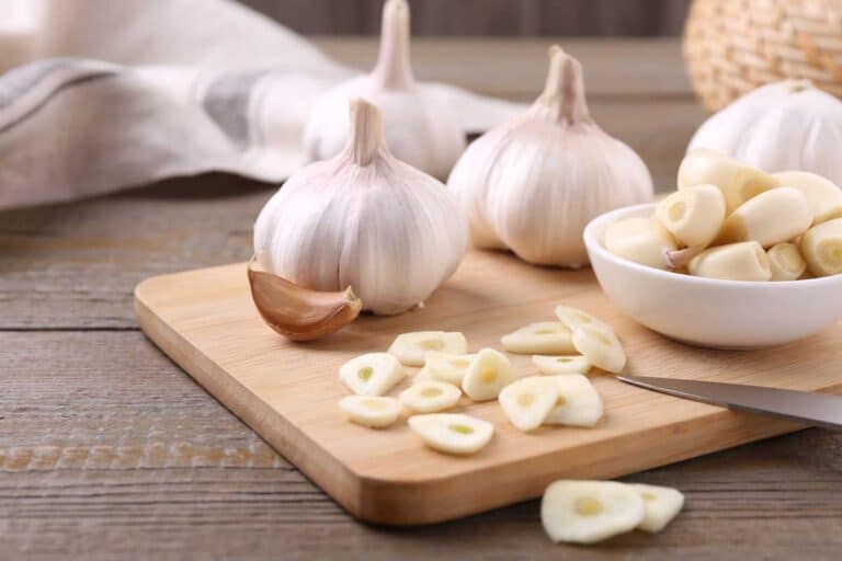 garlic bulbs on wooden background