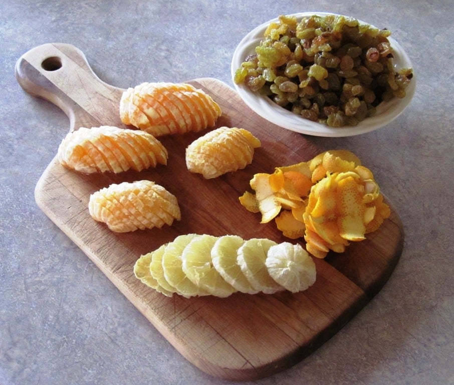 orange and lemon slices, zest, and raisins