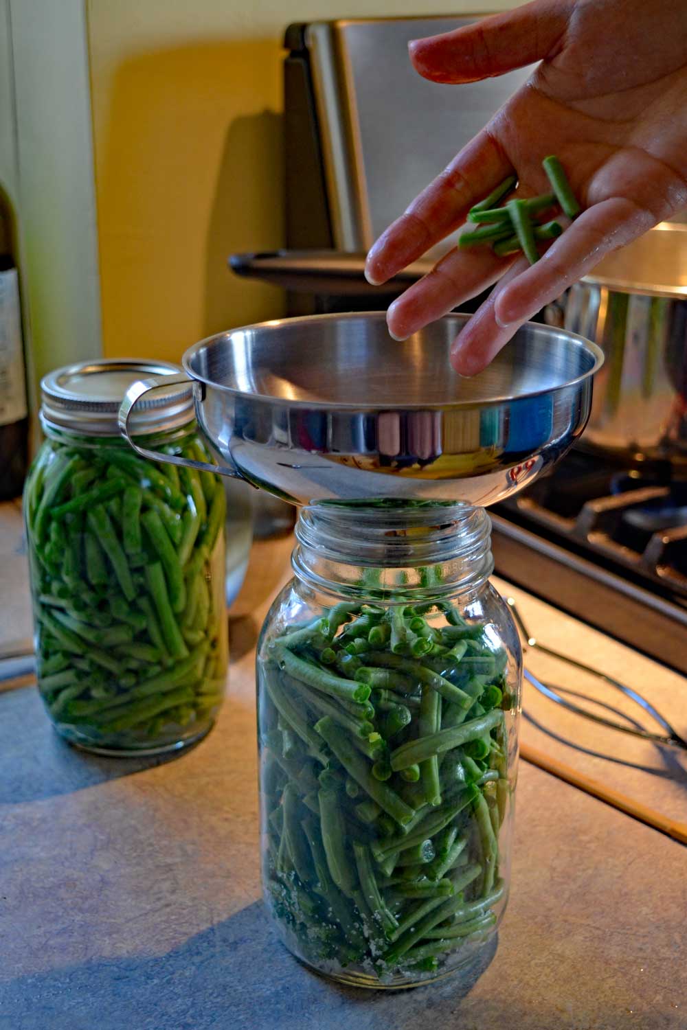 filling caning jars with beans