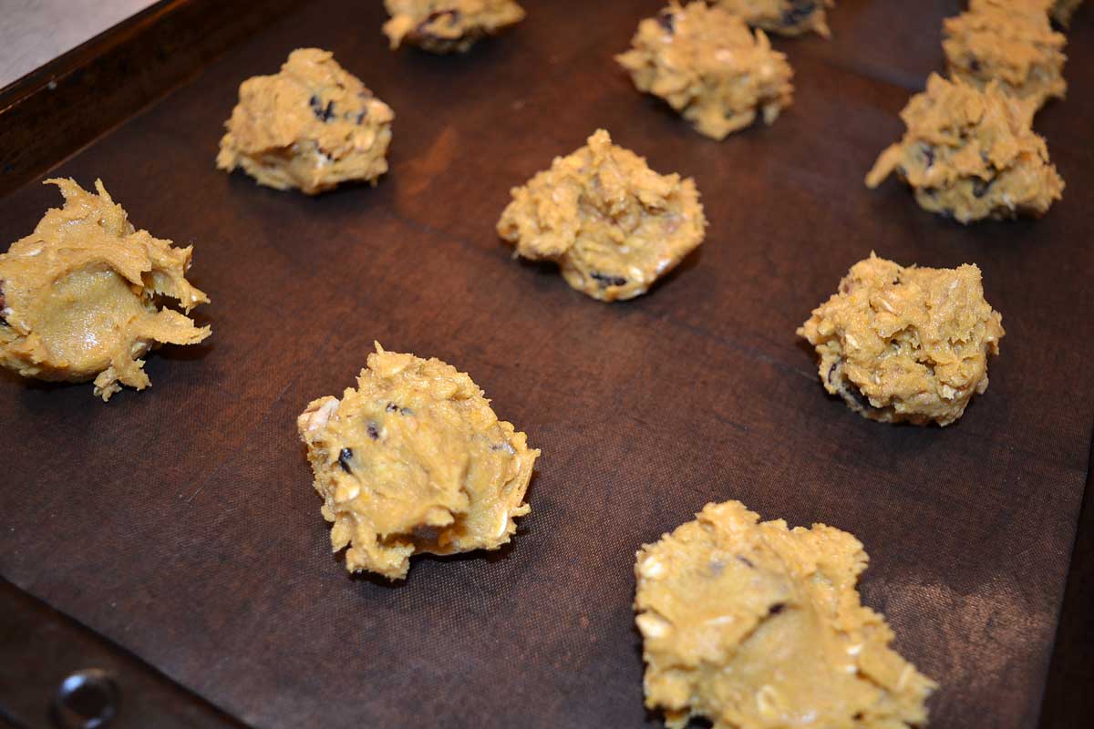 raw pumpkin oatmeal cookies on baking sheet