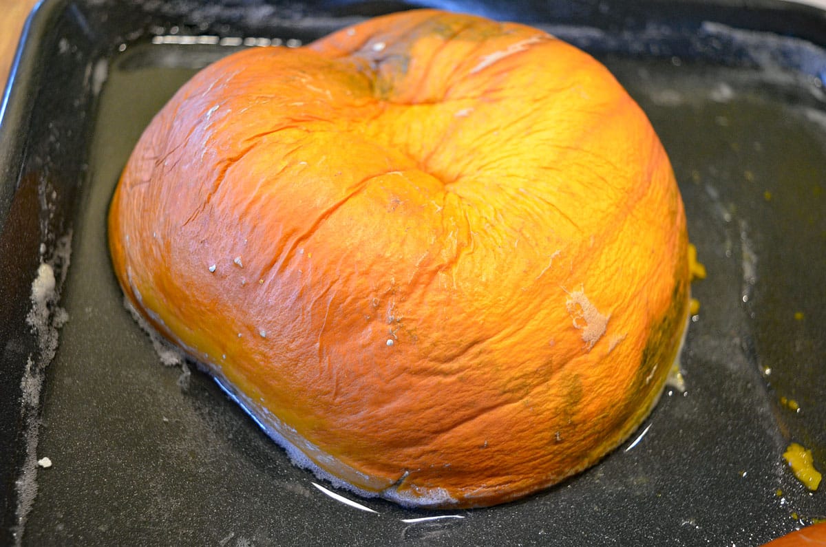 cooked pumpkin half on pan