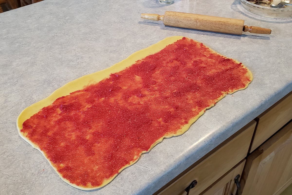 dough rectangle with berry spread