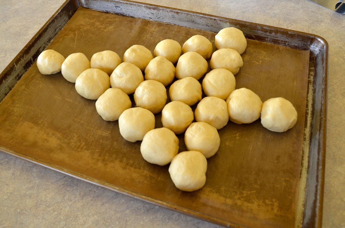 arranging the doughballs to make a tree shape