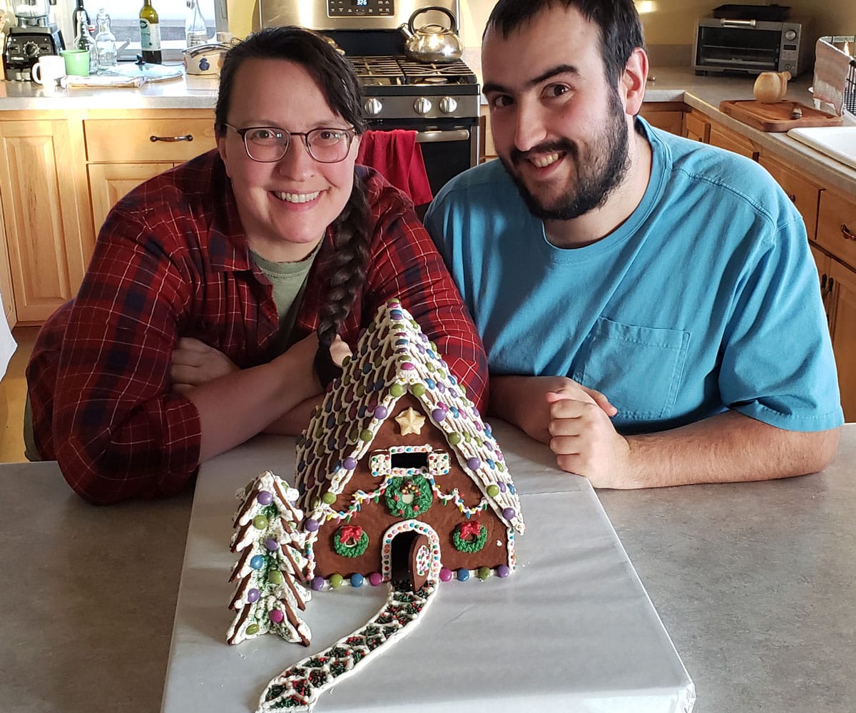 Laurie and Duncan with their gingerbread house