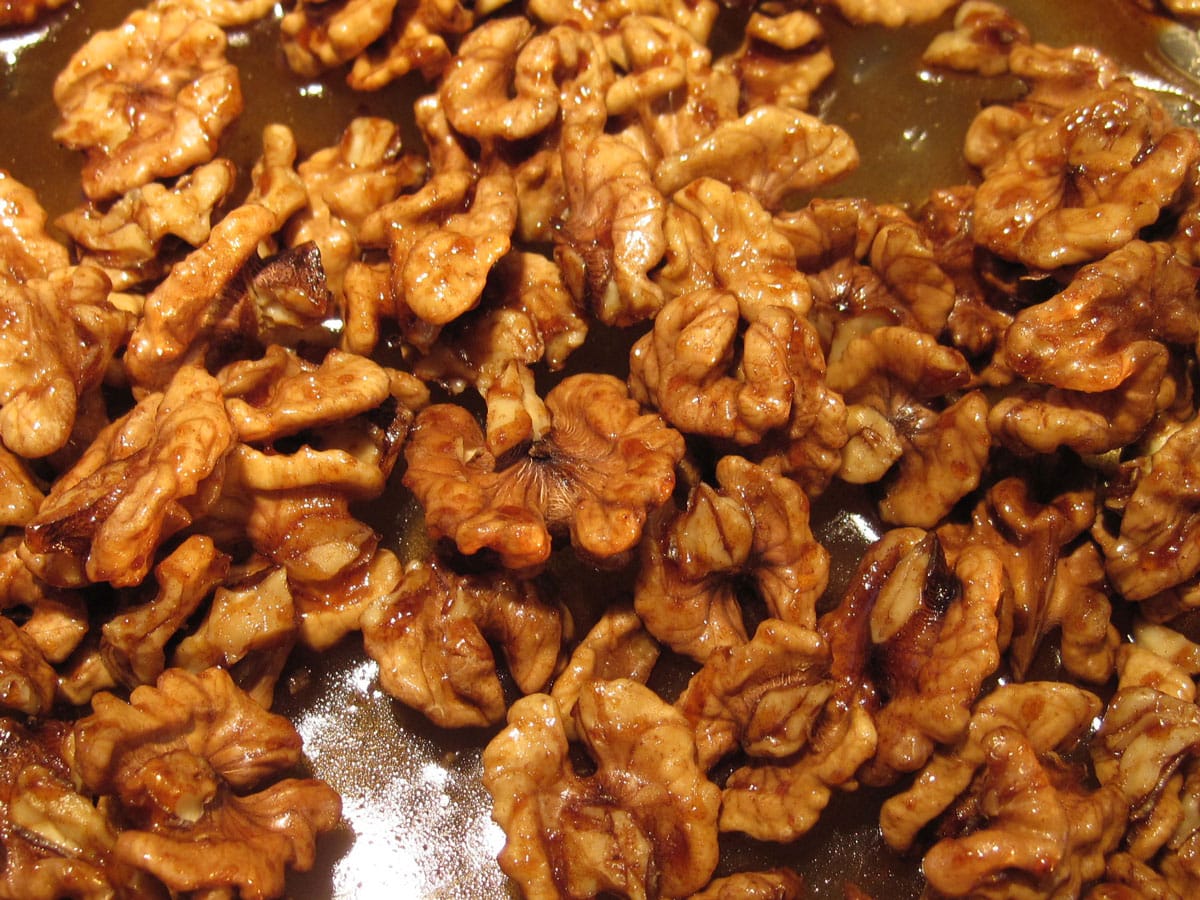 walnuts and candy coating in baking dish