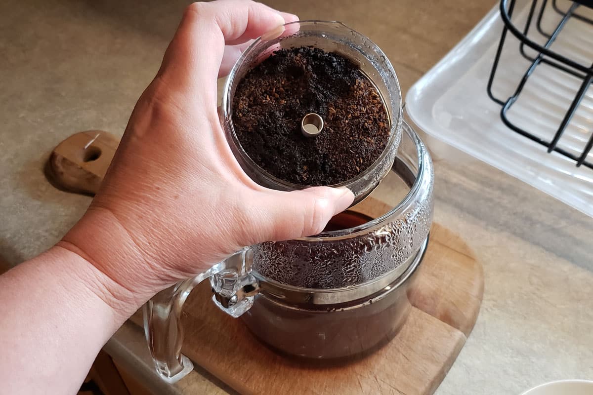 coffee grounds in glass percolator basket