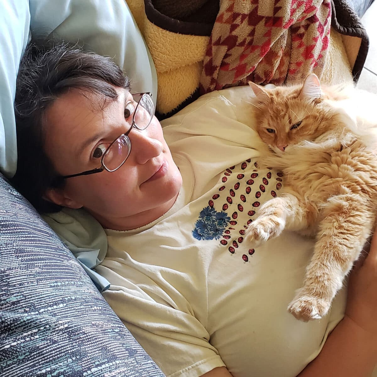 woman hugging a cat