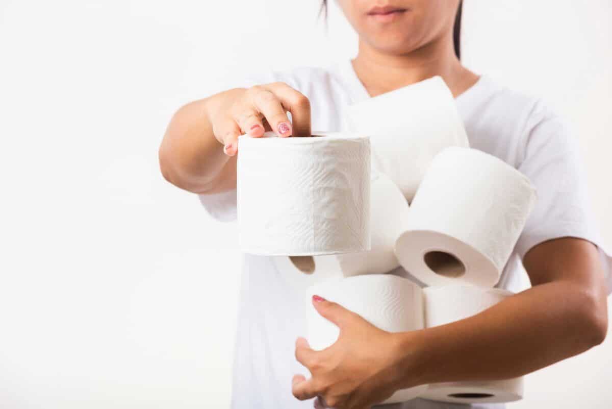 woman holding toilet paper