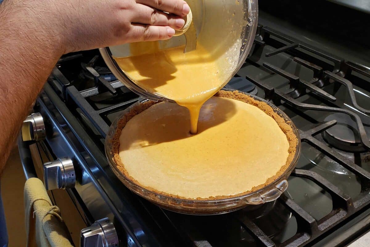 pouring the filling into the pie